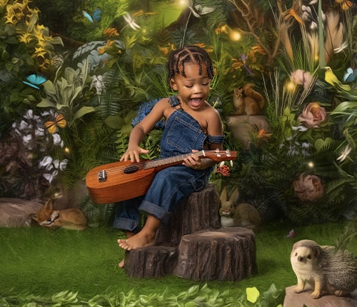 Child playing on a ukulele